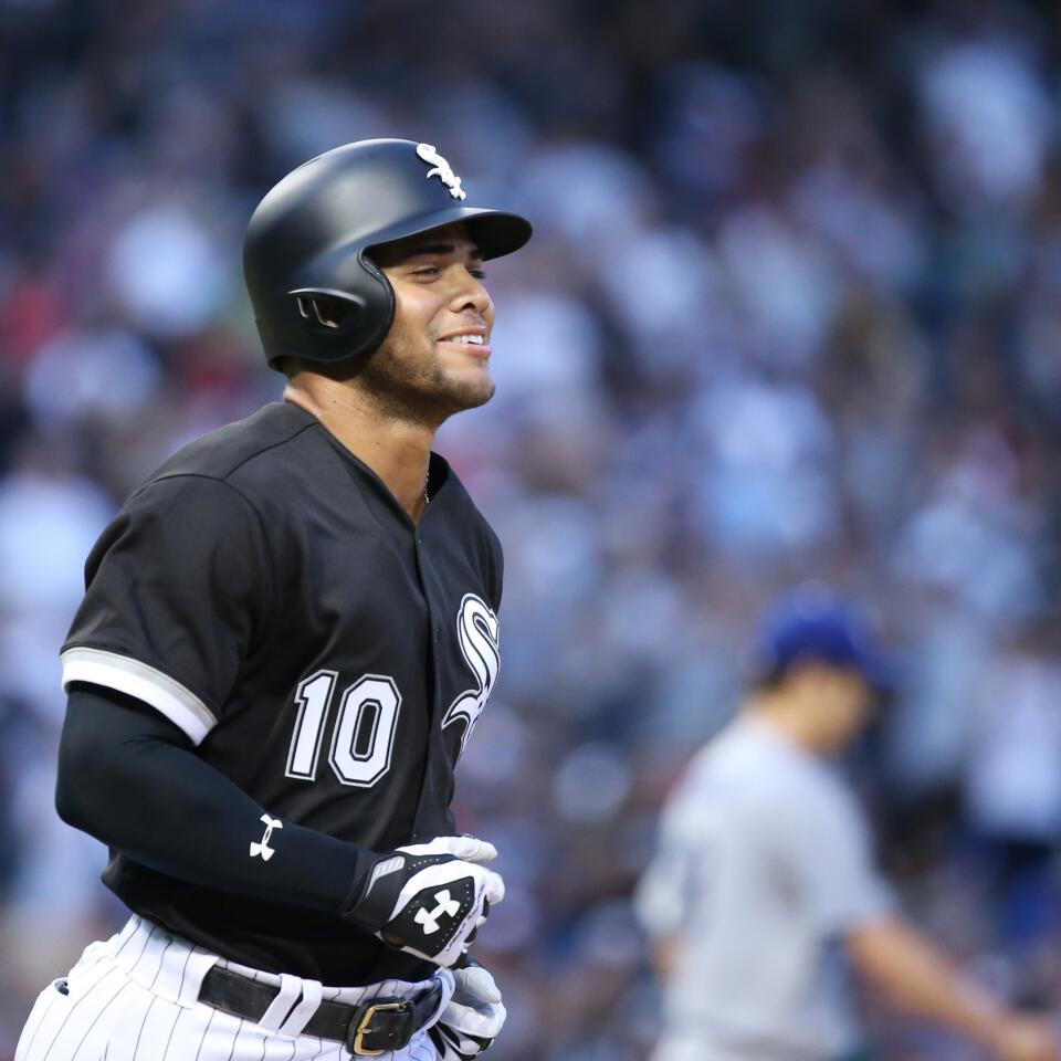 White Sox second baseman Yoan Moncada smiles while heading to first base on a walk in the second inning against the Los Angeles Dodgers at Guaranteed Rate Field on July 19, 2017.