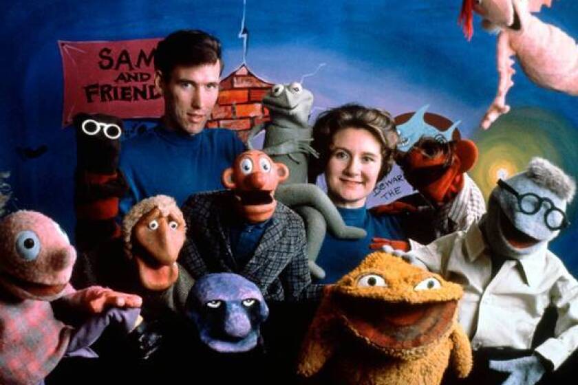 Jane Henson is shown with her husband, Jim Henson, and the cast of "Sam and Friends" in 1960.