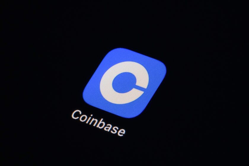 The Coinbase app icon is seen on a smartphone, Tuesday, Feb. 28, 2023, in Marple Township, Pa. Coinbase’s stock is tumbling before the market open on Thursday, March 23, after the cryptocurrency trading platform received a warning from the Securities and Exchange Commission that it could possibly face securities charges. (AP Photo/Matt Slocum)