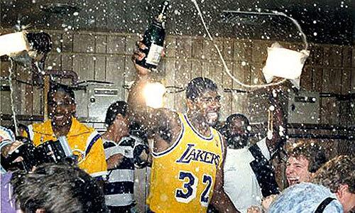 Laker Magic Johnson celebrates in the locker room in 1987 after defeating the Boston Celtics to win another NBA championship.