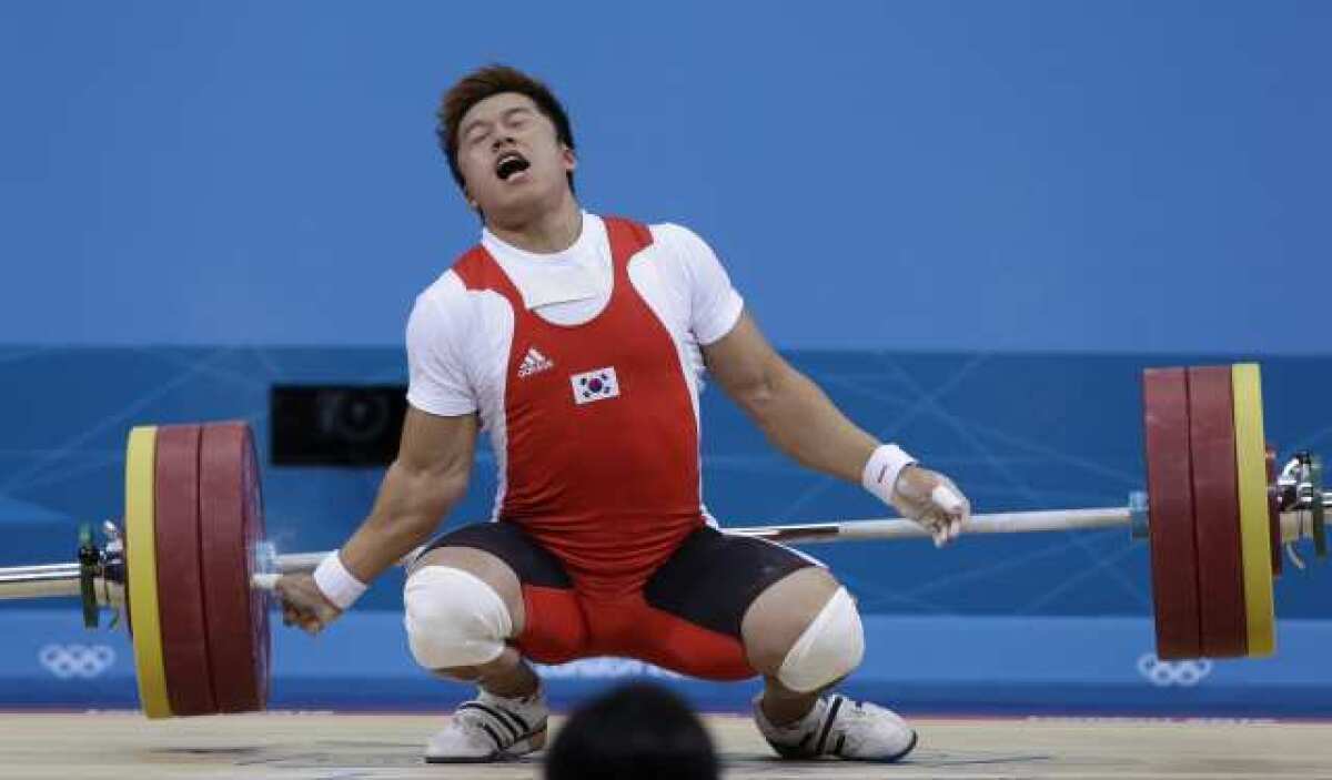 Sa Jae-hyouk of South Korea reacts after getting injured.