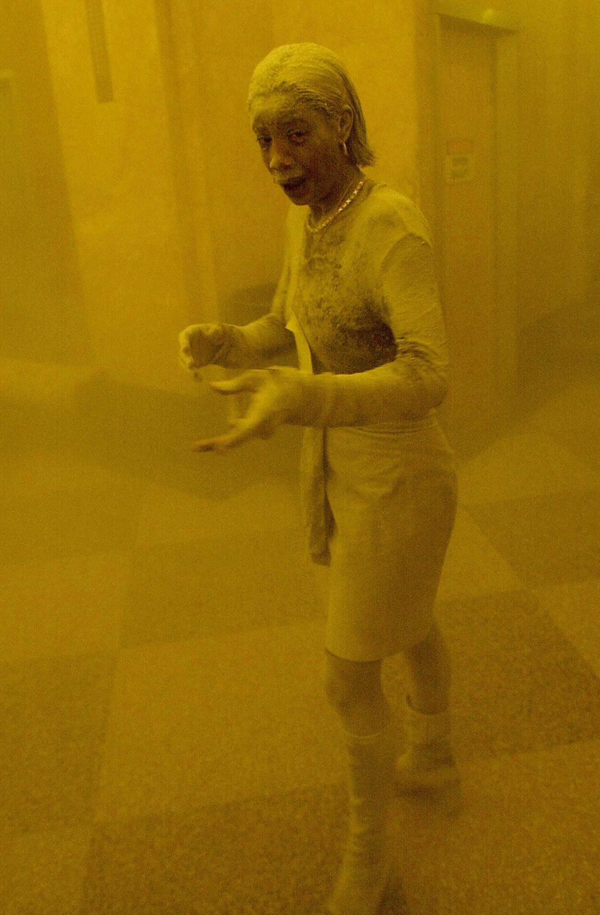 A woman is covered in dust