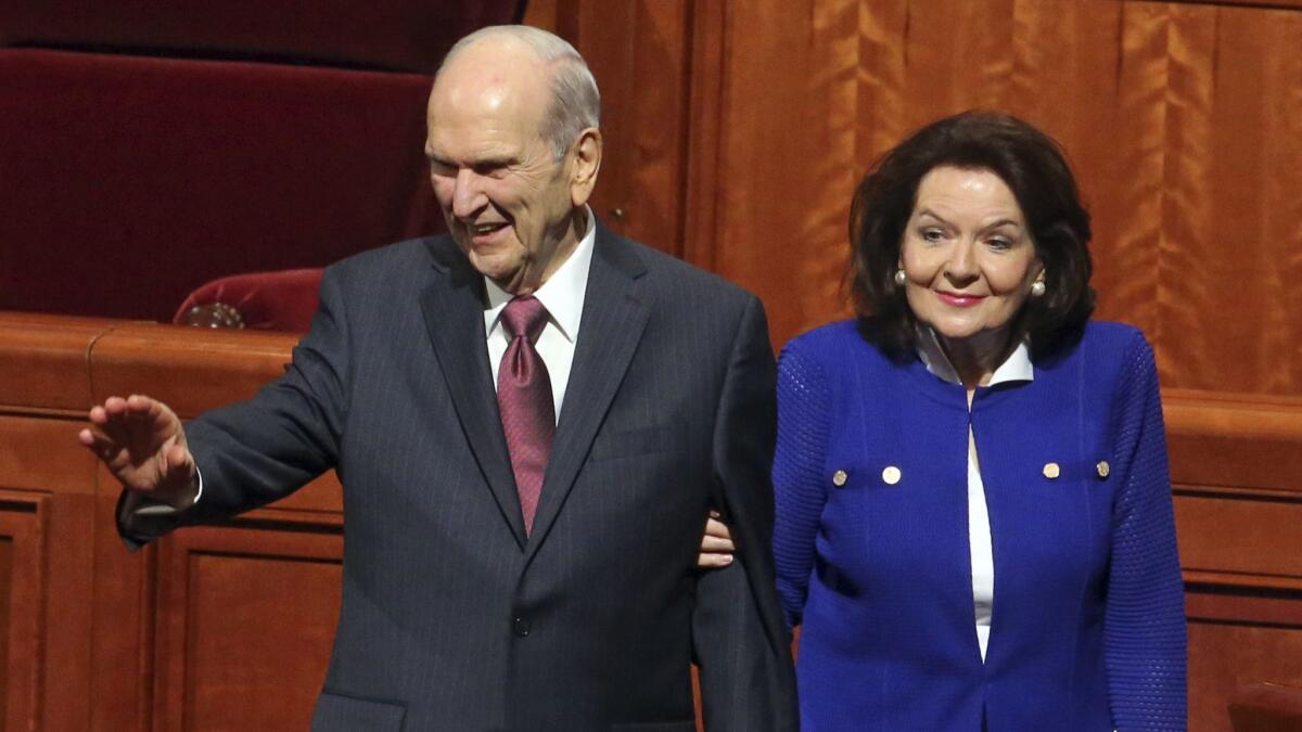 President Russell M. Nelson and his wife, Wendy, leave the morning session of the Church of Jesus Christ of Latter-day Saints conference Saturday in Salt Lake City.
