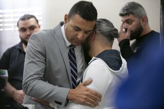 Ahmed Rehab, left, executive director of the Chicago chapter of the Council on American-Islamic Relations, embraces Odey Al-Fayoume, father of Wadea Al-Fayoume, 6, at a news conference at the Muslim Community Center on Chicago's Northwest Side, Sunday, Oct. 15, 2023. Authorities say a 71-year-old Illinois man has been charged with a hate crime, accused of fatally stabbing a 6-year-old boy and seriously wounding a 32-year-old woman, in Plainfield Township, because of their Islamic faith and the Israel-Hamas war. The Council on American-Islamic Relations identified the victims as Wadea Al-Fayoume and his mother. (Jim Vondruska/Chicago Sun-Times via AP)