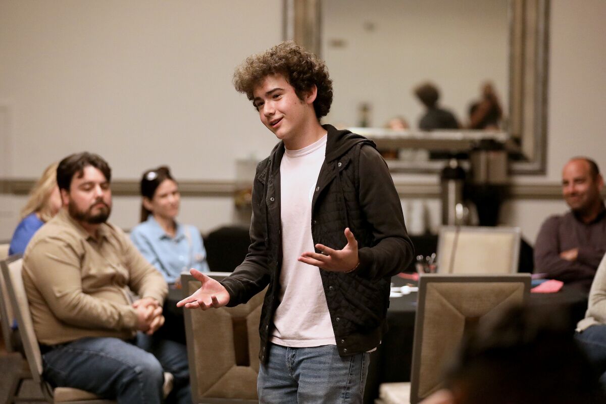 A student speaks during a workshop.