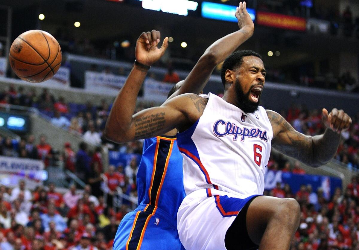 Clippers center DeAndre Jordan reacts after throwing down a dunk against the Thunder in Game 3 on Friday night at Staples Center.