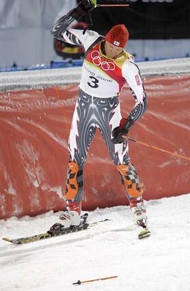 Kalle Palander of Finland throws his pole to the ground after being disqualified.