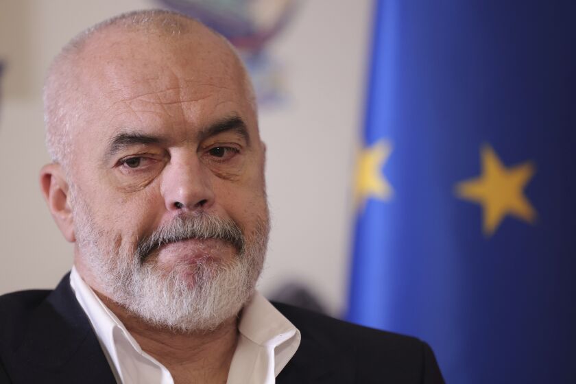 Albania's Prime Minister Edi Rama speaks during an interview with the Associated Press in Tirana, Albania, Monday, Dec. 5, 2022. Rama said Monday that a European Union summit in his country's capital this week demonstrates the EU's geostrategic interests in the Western Balkans region. (AP Photo/Franc Zhurda)