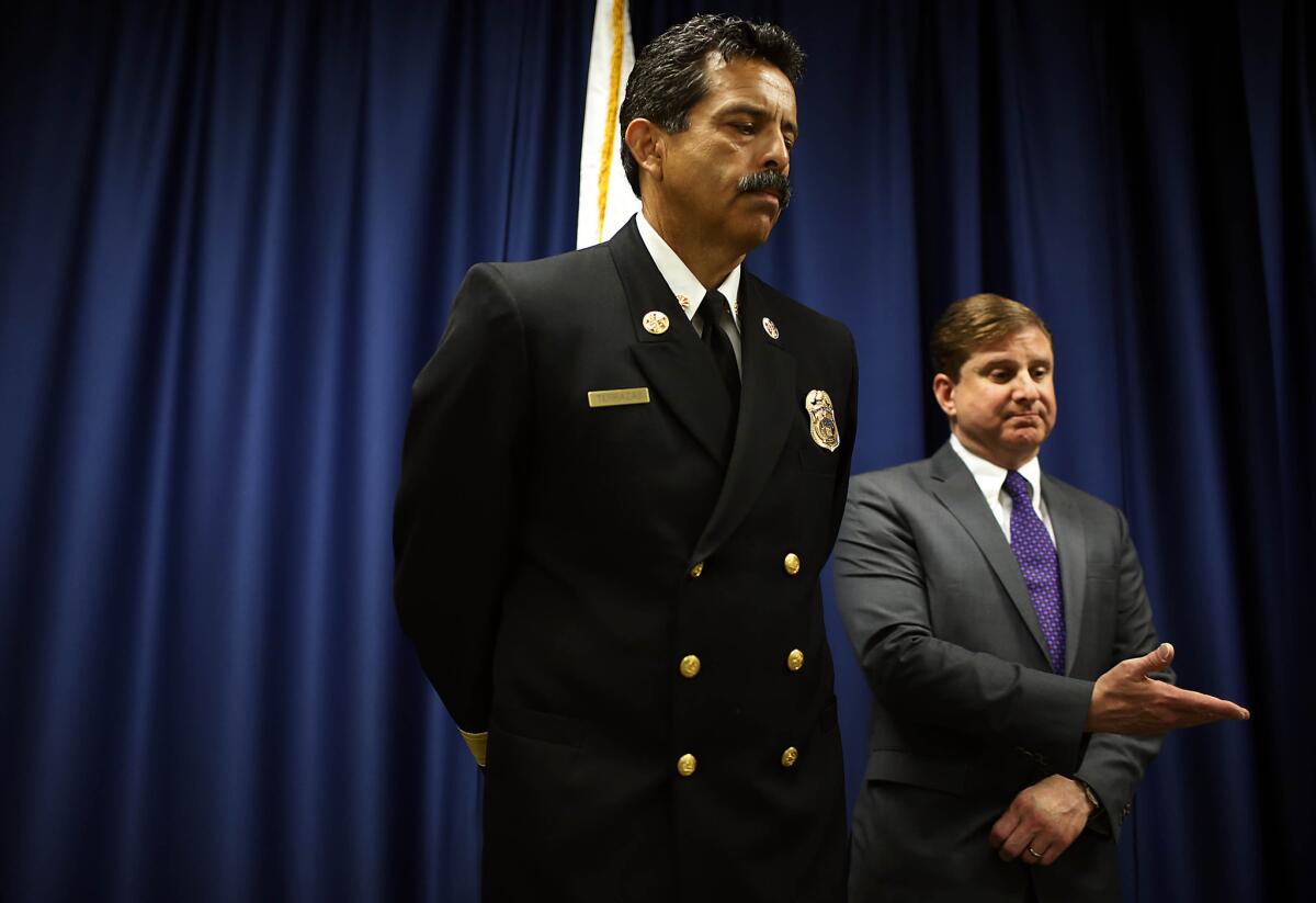 Los Angeles Controller Ron Galperin, right, invites L.A. Fire Department Chief Ralph M. Terrazas to answer questions about the findings that Los Angeles police and firefighters work in a culture that encourages filing "excessive" workers' compensation claims, according to a pair of city audits.
