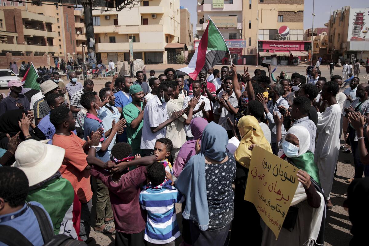 Protesters crowd a street in Khartoum, Sudan, on Saturday.