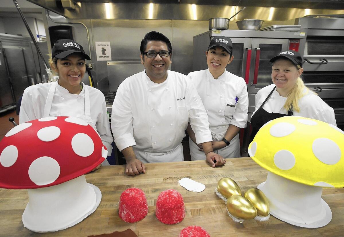 Isabel Rangel, chef Andy De la Cruz, Reina Rodriguez and Elizabeth Mendoza, from left, are building this year's Island Hotel Chocolate Factory gingerbread house inspired by the film character Willy Wonka.