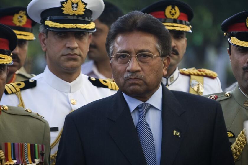 Outgoing President Pervez Musharraf is surrounded by top military officers as he leaves the Presidential House in Islamabad, Pakistan on Monday, Aug. 18, 2008. Musharraf announced his resignation Monday, ending a nearly nine-year tenure that opponents said was hampering the country's shaky return to democracy. (AP Photo/Emilio Morenatti) ORG XMIT: JEM119