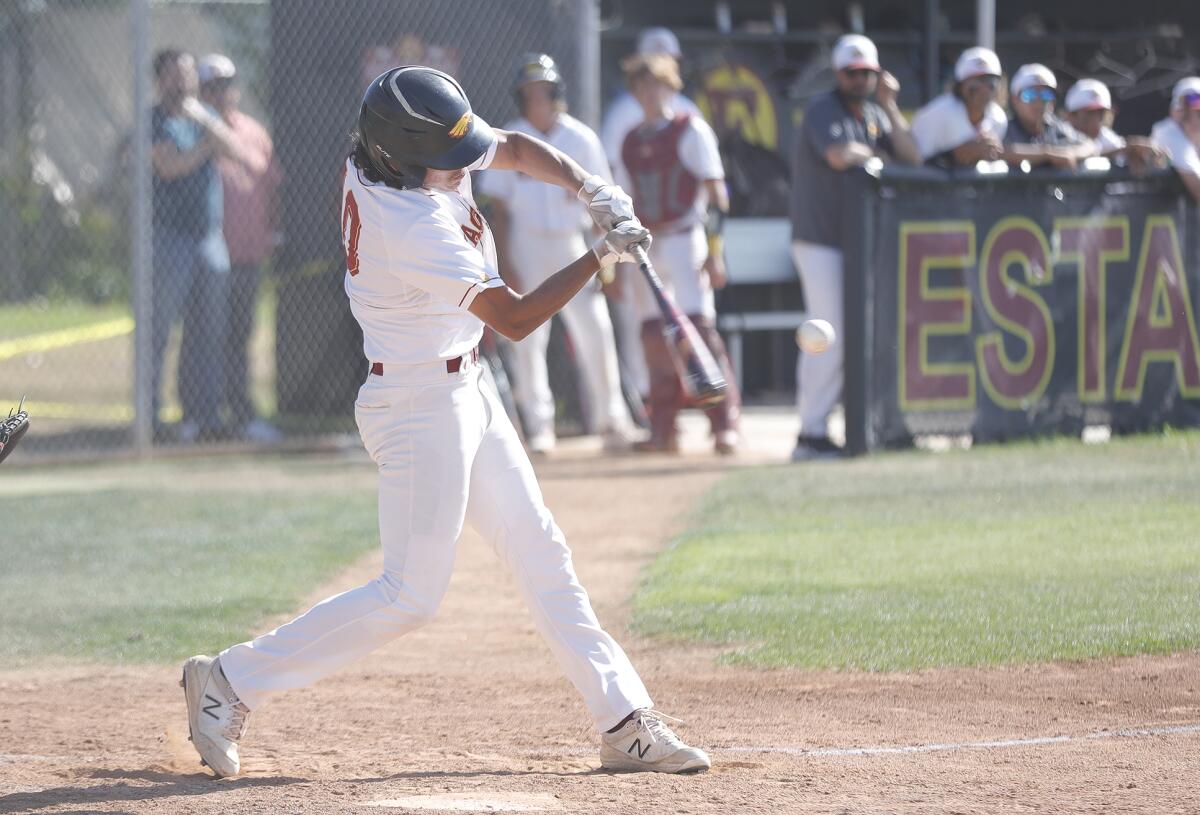 Estancia's James De La O slugs a hit during first round of the CIF Southern California Regional Division V championships.