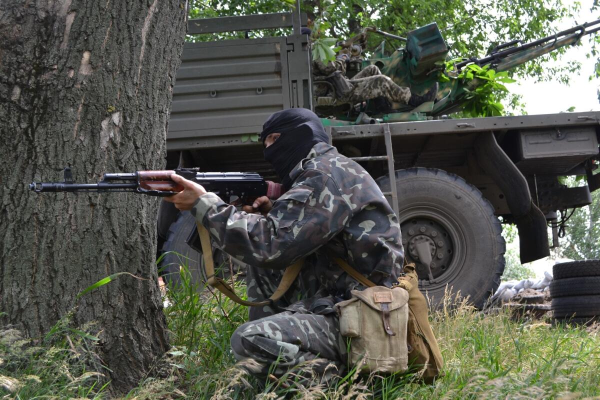Pro-Russian militants take positions to fight against Ukrainian government forces outside Slovyansk in eastern Ukraine on Tuesday.