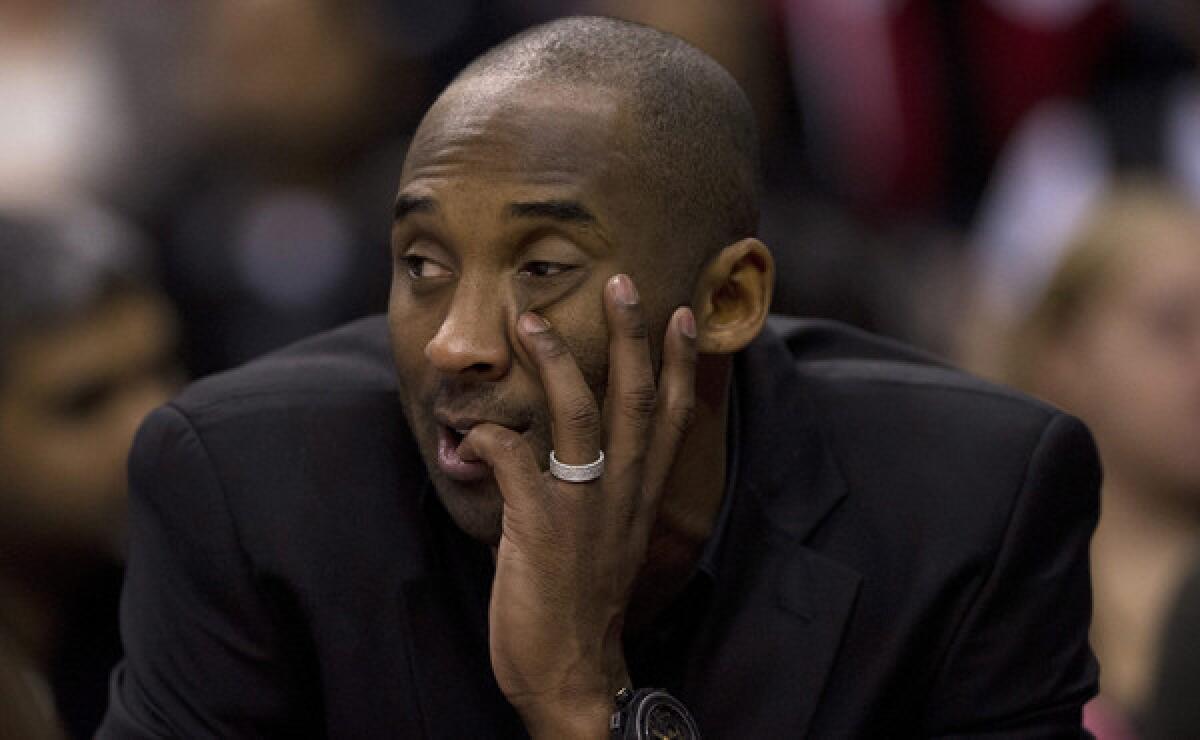 Injured Lakers star Kobe Bryant watches from the bench during a win over the Toronto Raptors on Jan. 19. Even Bryant understands he hasn't played enough to warrant an appearance in the NBA All-Star game.