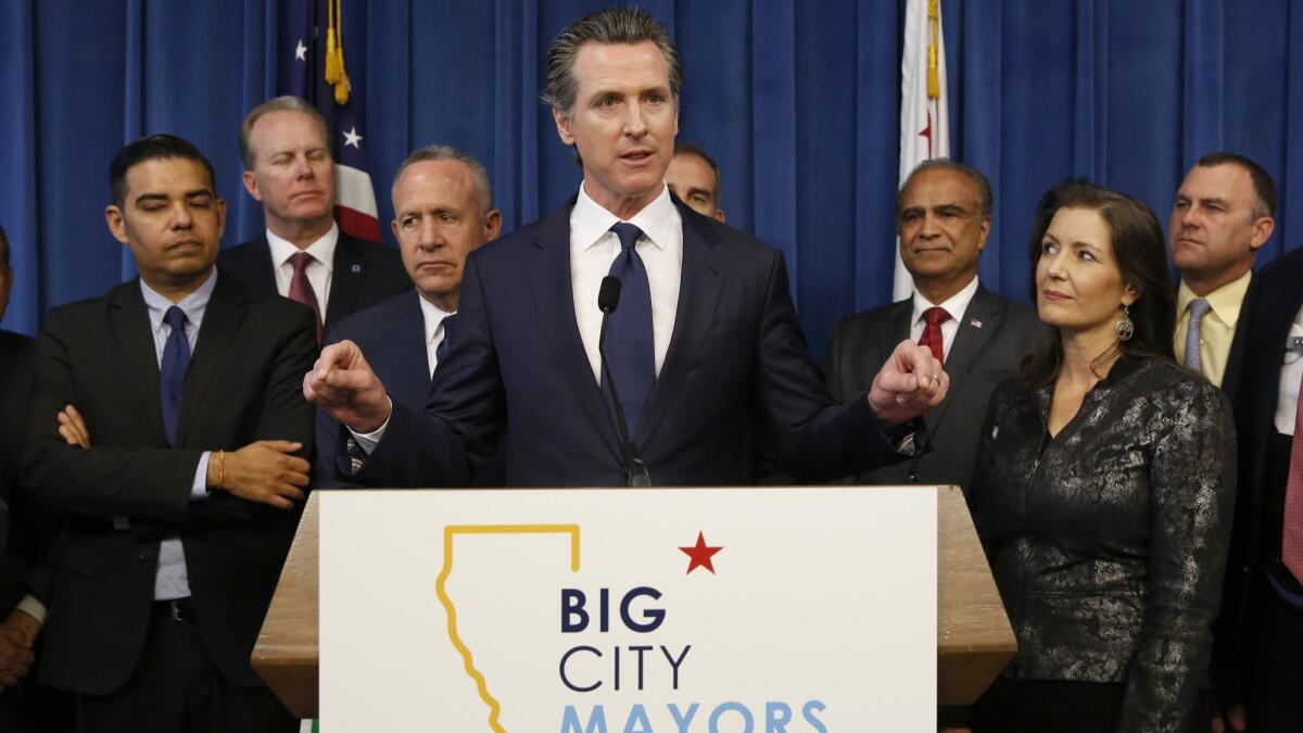 Gov. Gavin Newsom speaks at a news conference Wednesday after meeting with mayors from large California cities on homelessness funding.
