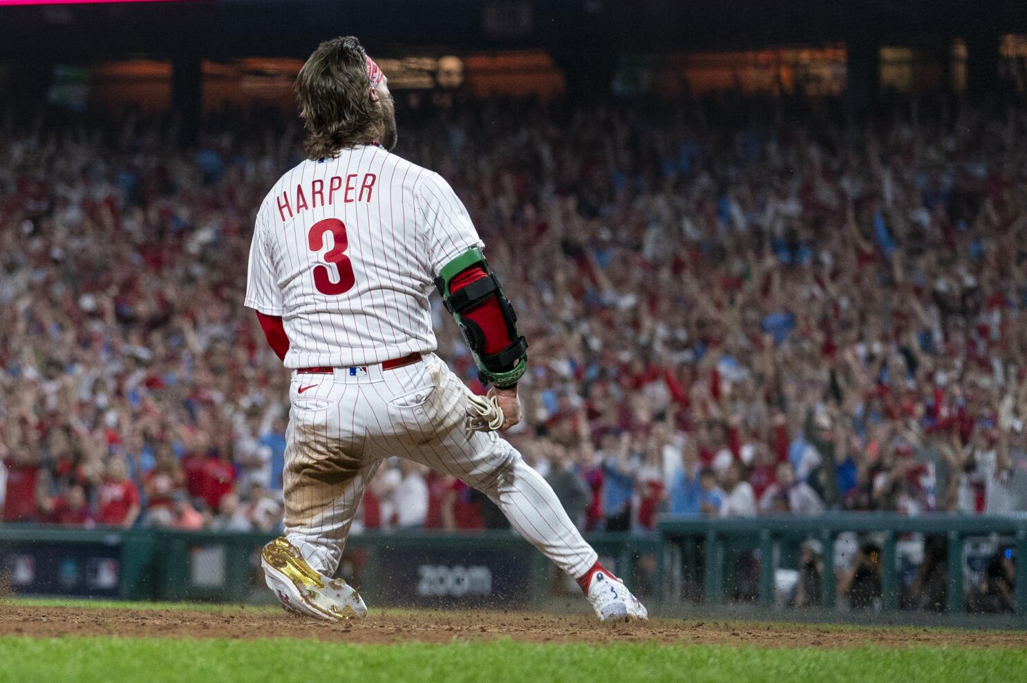 Philadelphia Phillies - Photo of Nick Castellanos wearing the powder blue  Phillies jersey in the dugout.