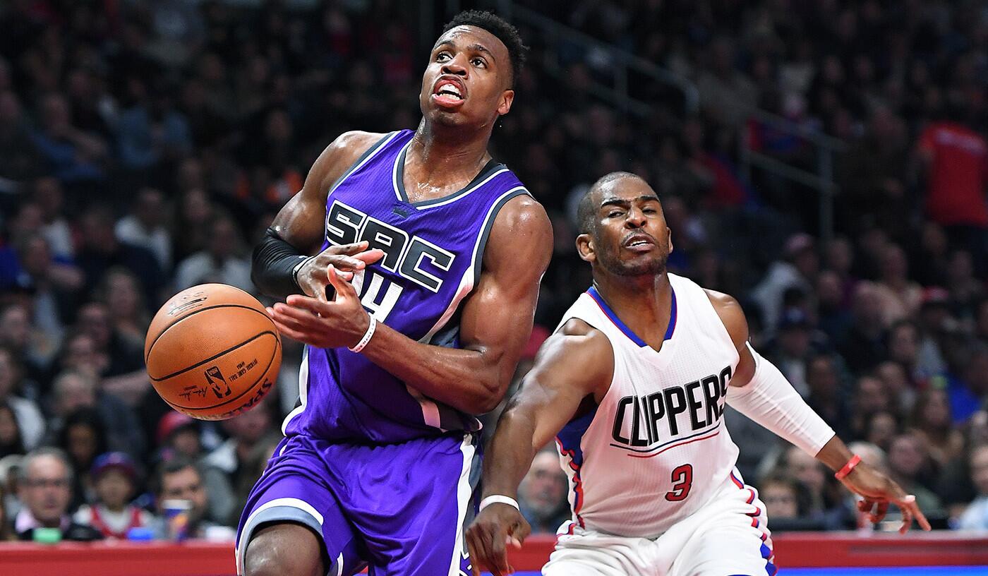 Clippers guard Chris Paul forces a turnover as he strips the ball away form Kings guard Buddy Hield during the second quarter of a game on April 12.