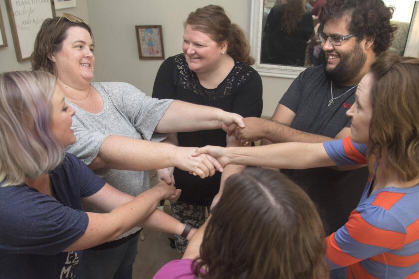 Riverside, CA - September 20, 2019 - (L/R) Katie Pitman, Andrea Torres, Nicole Winkfield, Willy Villalpando and Kristin Bell connect in an interactive game that helps figure out the nine personality types in Enneagram. The booming popularity of Enneagram has lead to workshops and party gatherings. (Ana Venegas)