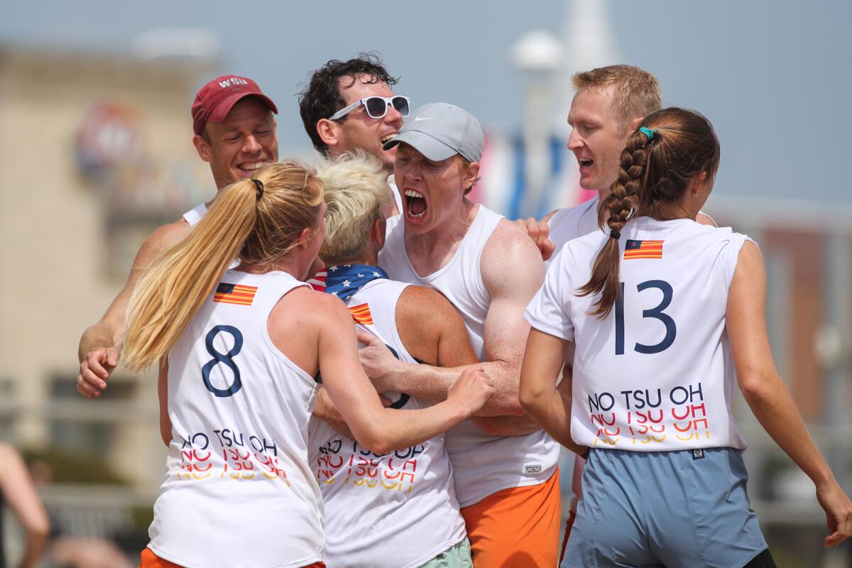 Team members celebrate a victory at the 2022 Beach Nationals, which were held in Virginia Beach.