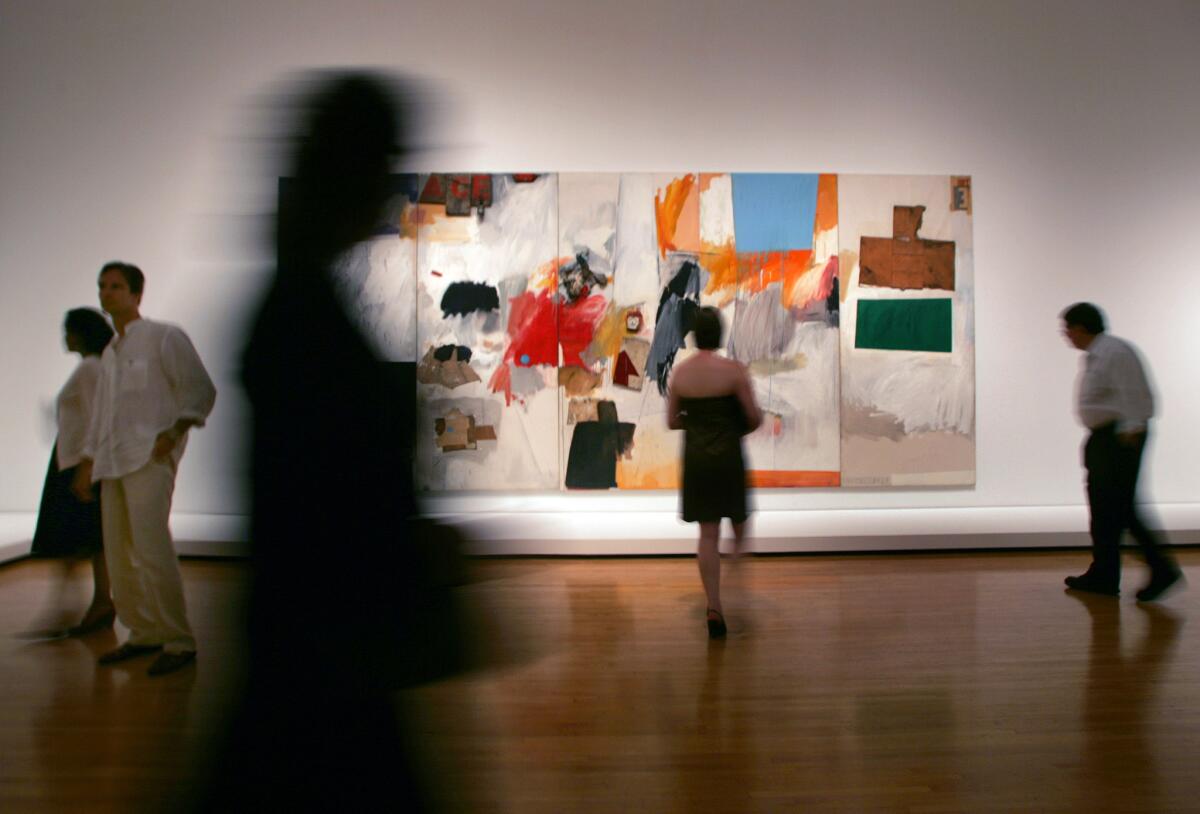 Visitors make their way past Robert Rauschenberg's "Ace," from 1962, at the Museum of Contemporary Art in 2006.