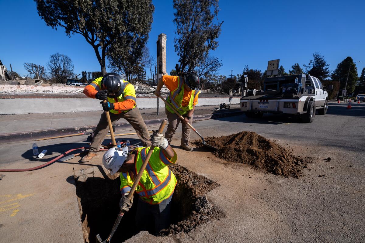 Southern California Gas Company contractors from left, Eric