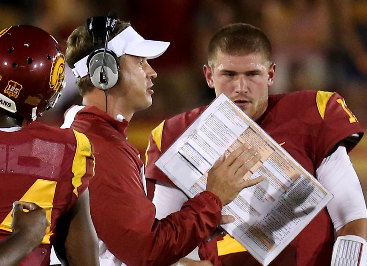 USC Coach Lane Kiffin isn't about to delegate offensive play-calling duties to one of his assistant coaches.