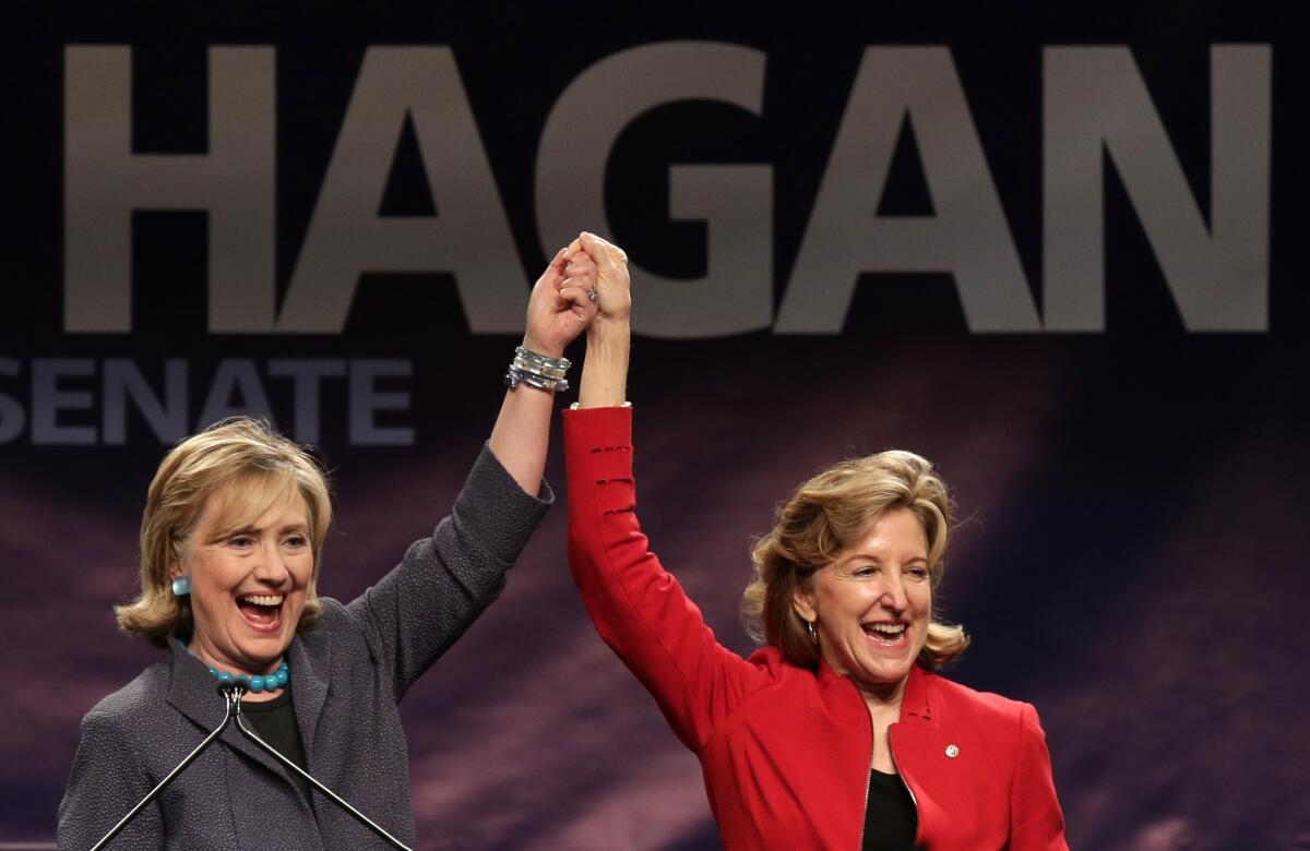 Former Secretary of State Hillary Clinton, left, campaigns with Sen. Kay Hagan (D-N.C.) in Charlotte, N.C., on Saturday. Hagan is in a tight reelection race against Republican state House Speaker Thom Tillis.