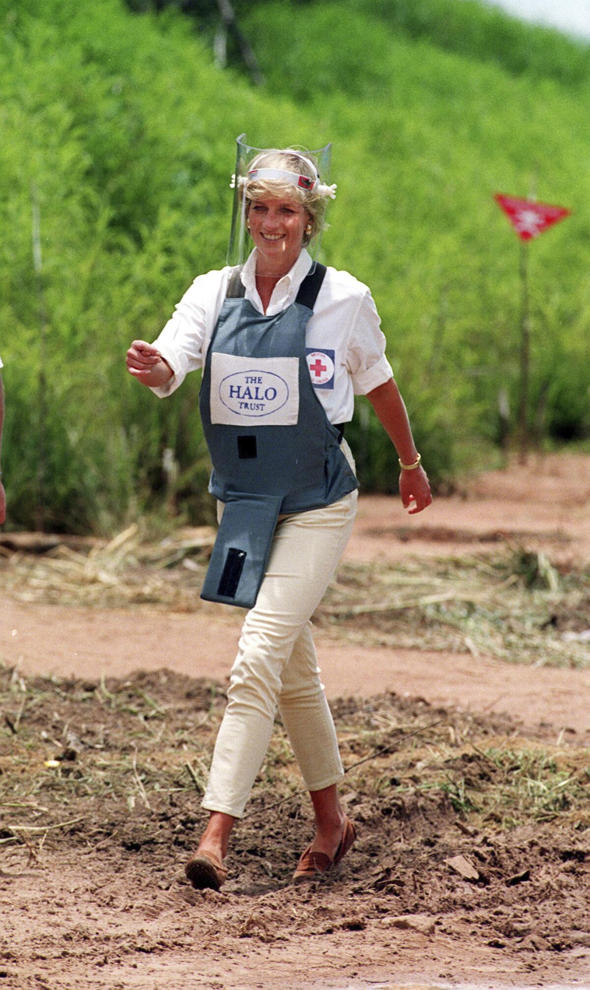 January 1997: Princess Diana, wearing a bombproof visor, visits a minefield in Huambo, Angola. 
