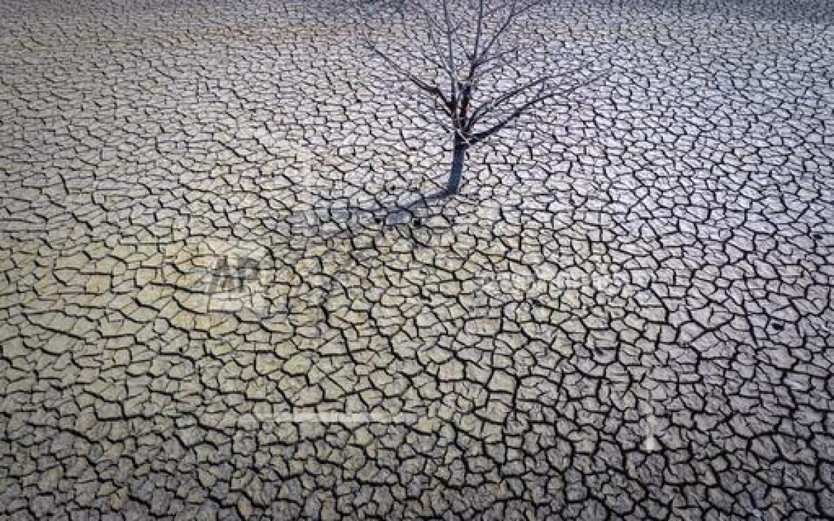 FILE - View of the dry Sau reservoir about 100 km (62 miles) north of Barcelona. Spain, 