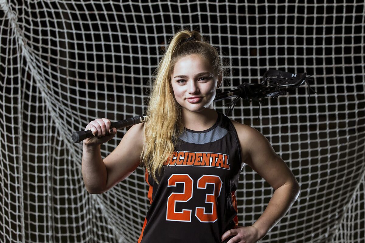 This photo provided by Occidental College shows lacrosse player Julia Shwayder in 2022. Julia Shwayder and Breyon Jackson’s battles to overcome adversity throughout their college careers as well as serving as an example for others have been recognized. Shwayder and Jackson, a basketball player at San Francisco State University, are the recipients of the first CalHOPE Courage Award. (Sam Leigh/Occidental College via AP)