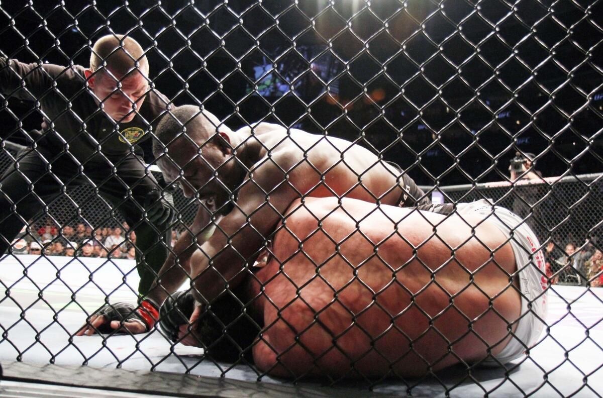 Jon Jones, the reigning light-heavyweight champion, tries to finish off challenger Chael Sonnen during their title fight on Saturday night at UFC 159 in Newark, N.J.