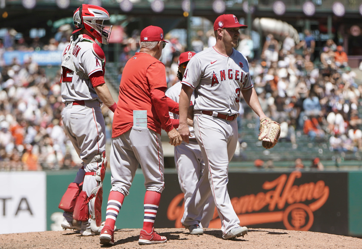 Angels manager Joe Maddon pulls starter Dylan Bundy from the game in the sixth inning.