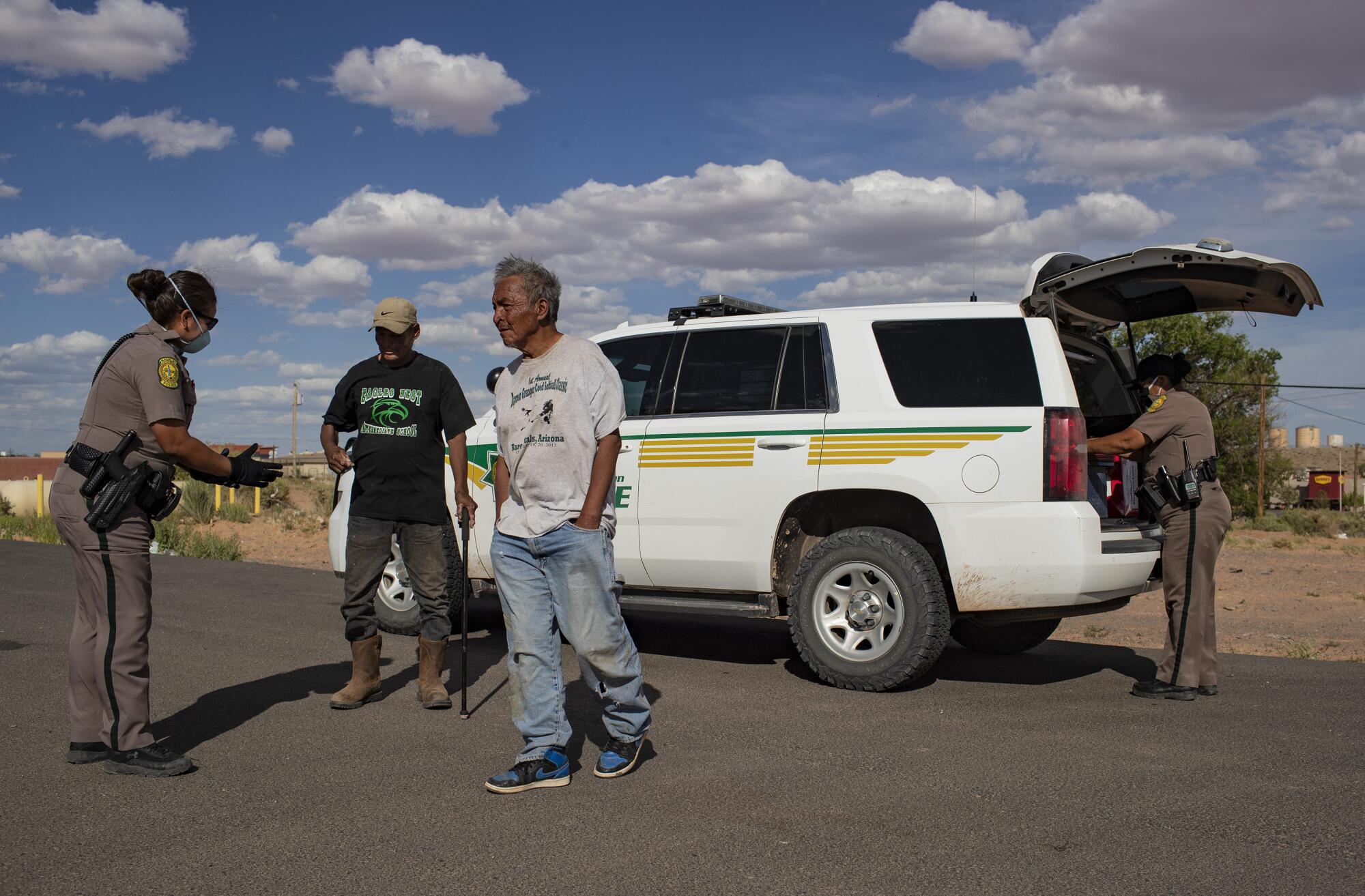Navajo Nation police officers stop two men in Tuba City