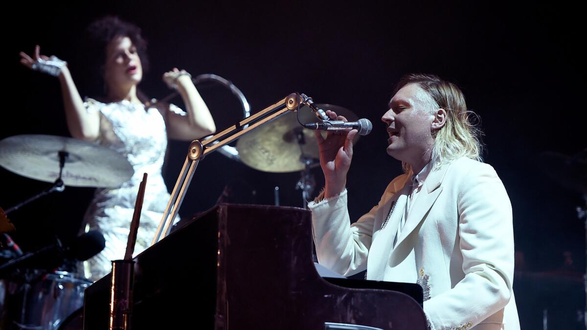 Regine Chassagne and Win Butler of Arcade Fire perform at the Panorama festival on New York's Randall's Island on Saturday.