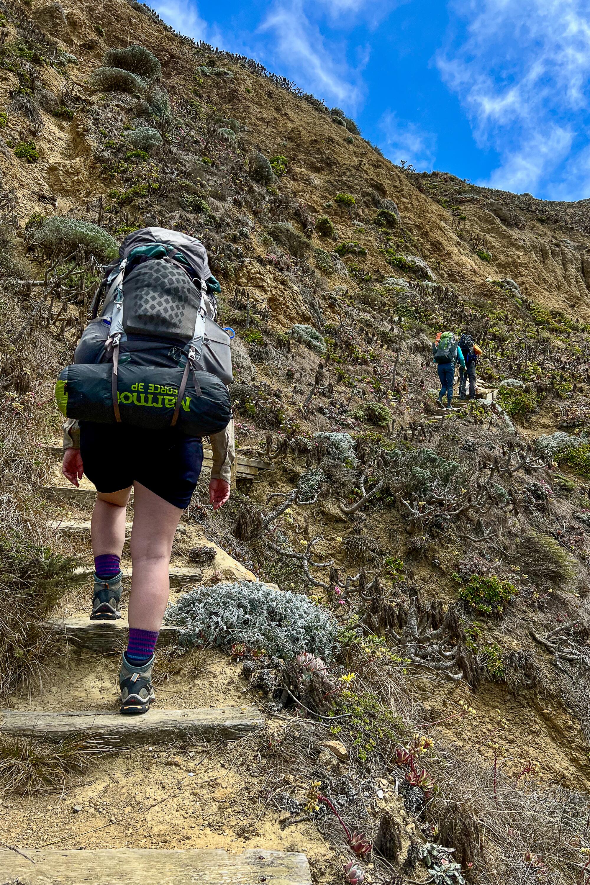 Backpackers ascend the trail up Nidever Canyon to the sole campground on San Miguel Island.