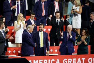 MILWAUKEE, WI JULY 16, 2024 -- Republican presidential candidate former President Donald Trump points to Republican vice presidential candidate Sen. J.D. Vance during the 2024 Republican National Convention at Milwaukee, WI on Tuesday, July 16, 2024. (Jason Armond / Los Angeles Times)
