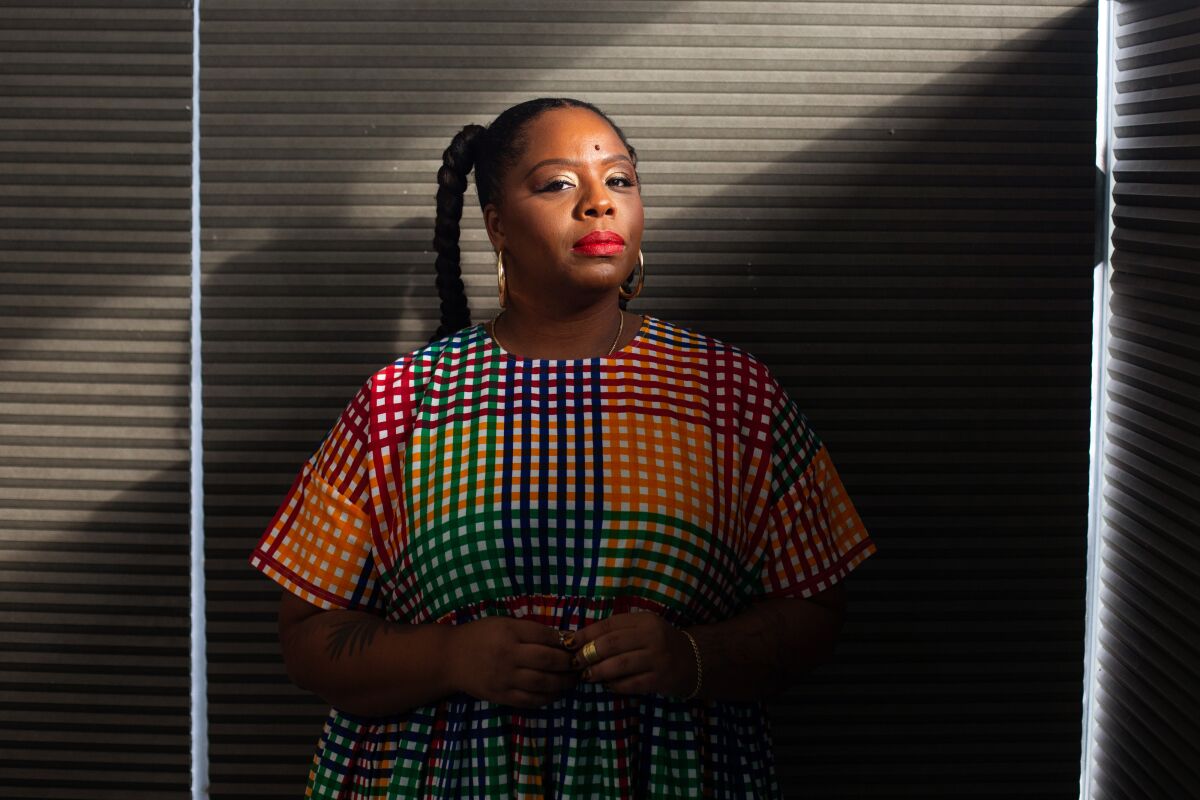 Patrisse Cullors poses for a portrait at the Crenshaw Dairy Mart in Inglewood.