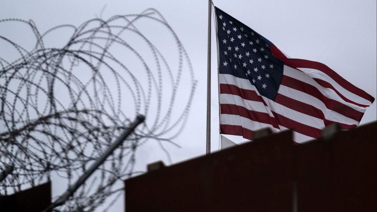 A U.S. flag near the border fence in San Diego County.