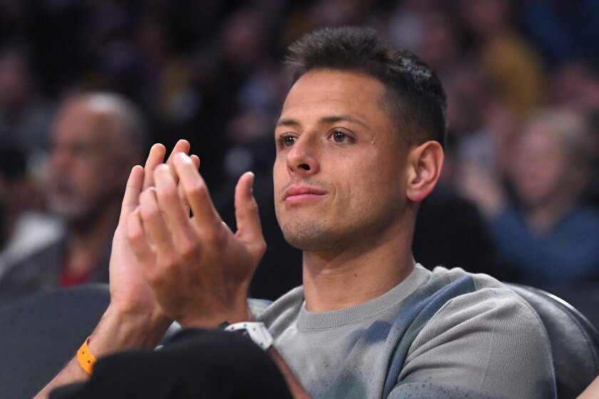 Galaxy striker Javier "Chicharito" Hernández sits courtside for the Lakers-76ers game March 3 at Staples Center. 