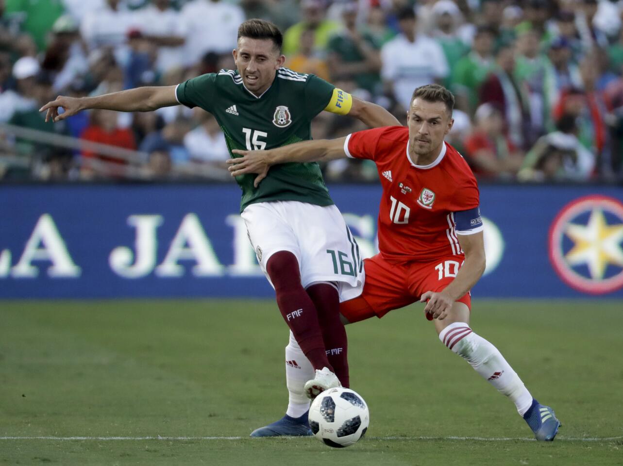Wales' Tom Lockyer, right, pushes Mexico's Hector Herrera during the first half of their soccer match, Monday, May 28, 2018, in Pasadena, Calif. (AP Photo/Chris Carlson)