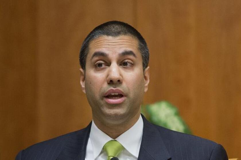Federal Communications Commission Chairman Ajit Pai, shown at a 2015 commission meeting, recently withdrew a proposed new rule on pay-TV set-top boxes that his predecessor had circulated.