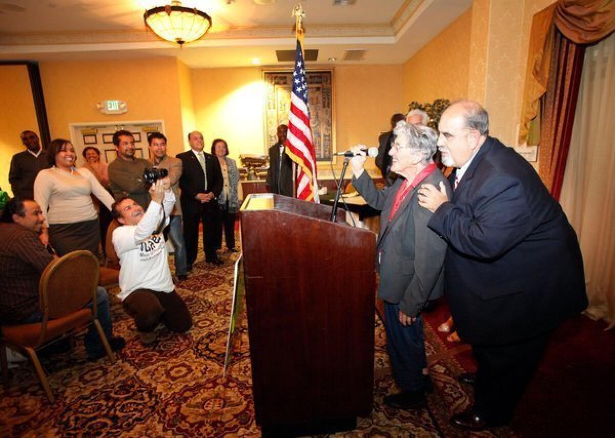 Hawthorne's Daniel Juarez, right, shown at an event in 2011 while he was still mayor-elect, faces new perjury charges.
