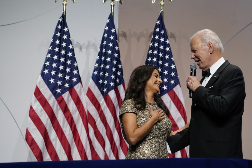President Joe Biden talks with Rep. Nanette Barragán, D-Calif., as he speaks at the 45th Congressional Hispanic Caucus Institute Gala to kick-off the White House's celebration of Hispanic Heritage Month at the Walter Washington Convention Center, Thursday, Sept. 15, 2022, in Washington. (AP Photo/Alex Brandon)
