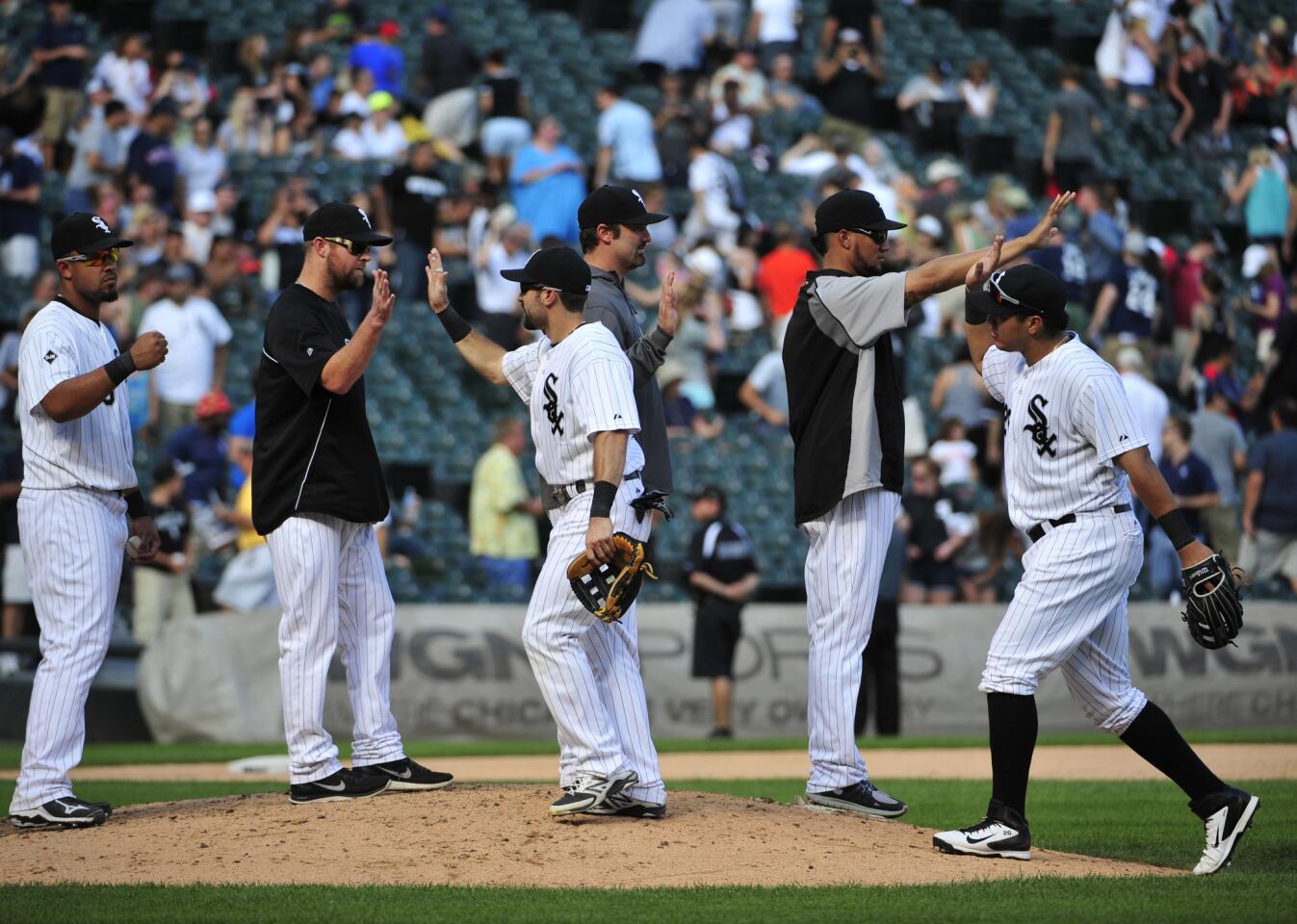 The White Sox celebrate their win against the Tigers on Sunday.