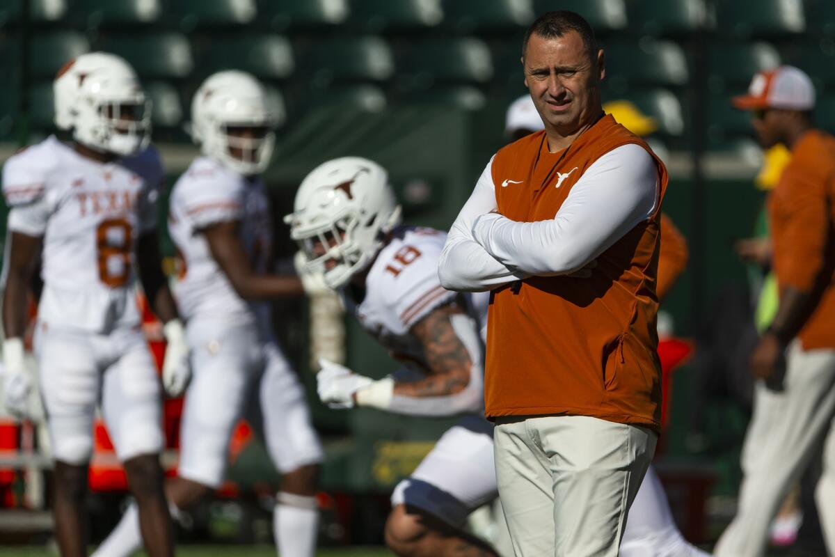 Texas coach Steve Sarkisian watches his players warm up before a game against Baylor on Oct. 30.