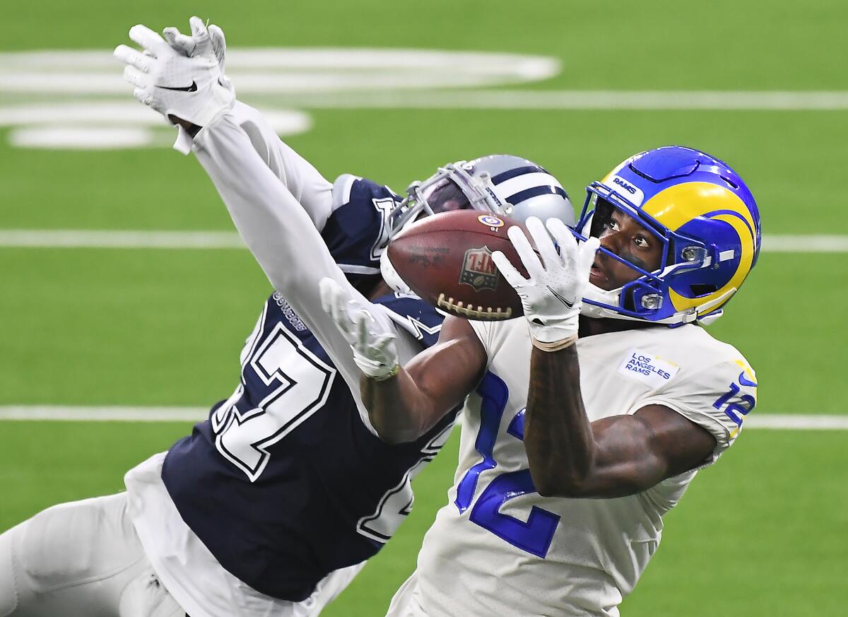 Rams receiver Van Jefferson Jr. makes a catch in front of Cowboys cornerback Trevon Diggs.