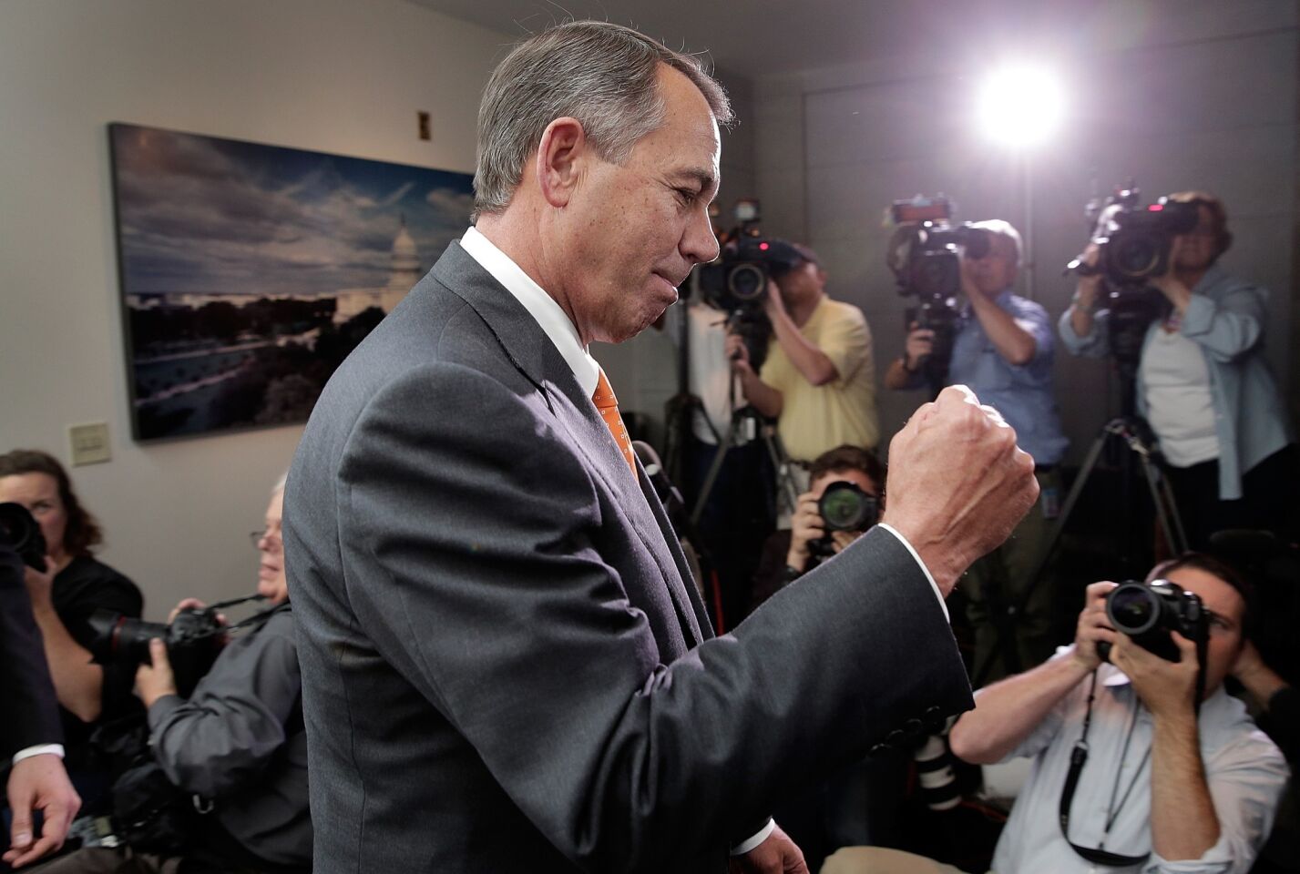 Speaker of the House John A. Boehner (R-Ohio) pumps his fist after leaving a meeting of House Republicans. Congress voted Oct. 16 to end a 16-day government shutdown and allow the Treasury to continue borrowing to pay the nation's bills. President Obama signed the budget deal shortly thereafter.