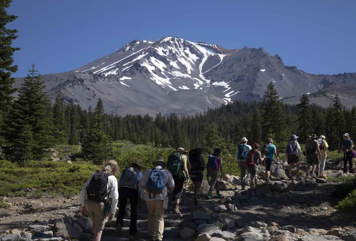 A group sets out to hike one of the many trails at Mt. Shasta. 