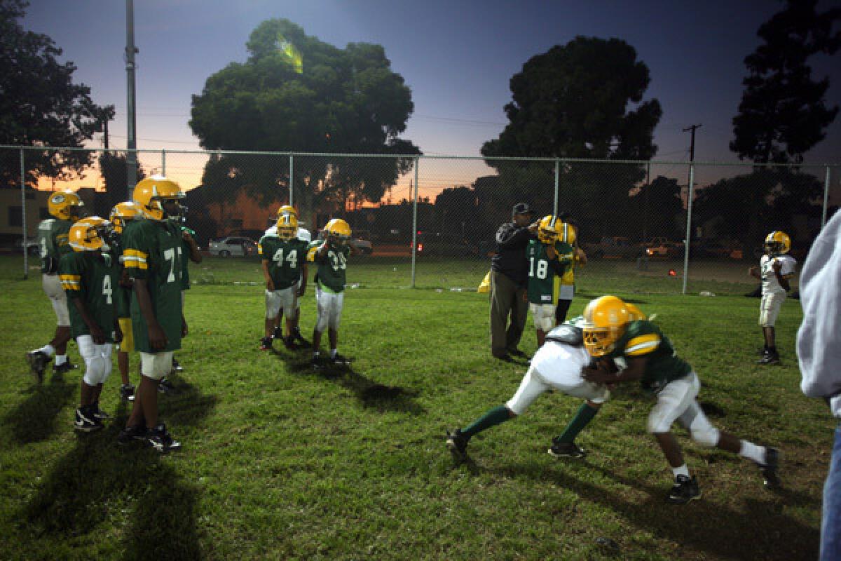 The South Park Demos go through football drills in preparation for a Saturday matchup against rival Compton. The Demos football program was brought to South Park by Parie Dedeaux, better known as Blue. More photos >>>